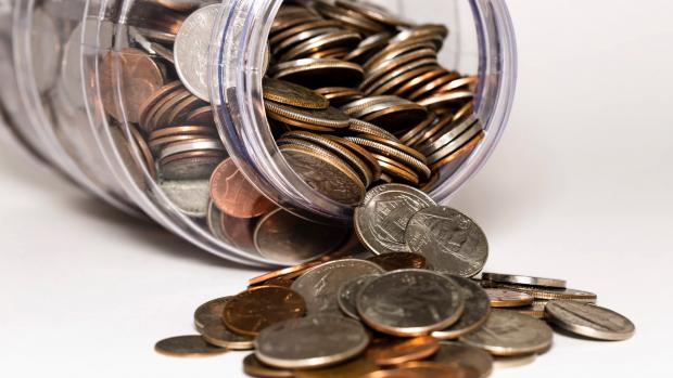 coins spilling out of a jar