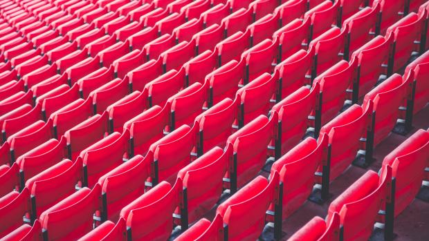 rows of plastic red chairs