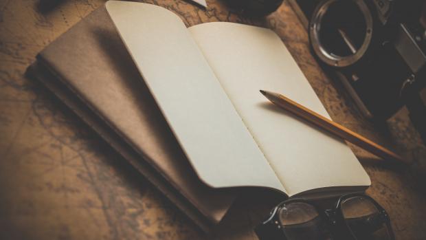 book and pencil on a table