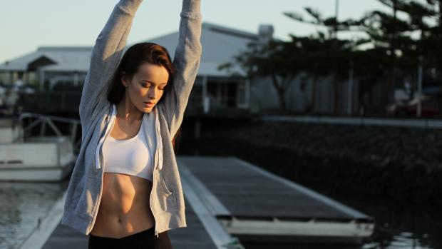 woman stretching before a workout