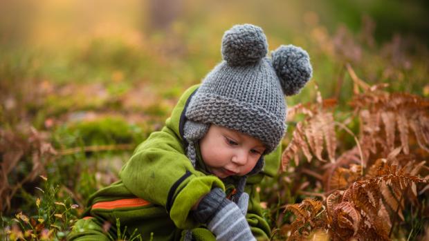 Child playing in grass