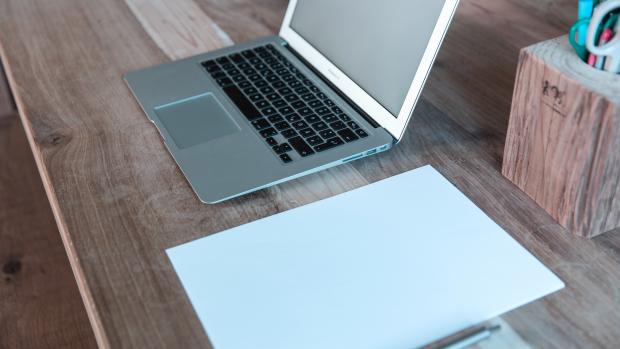 laptop on wooden table